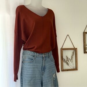 Elegant V-Neck Sweater in Terracotta Color
From Ninexis Size M/L 50% Rayon